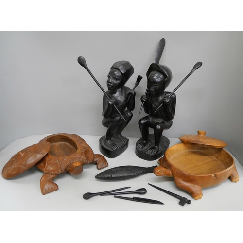 2119 - A collection of wood carvings, including African tourist pieces