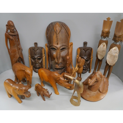 2119 - A collection of wood carvings, including African tourist pieces