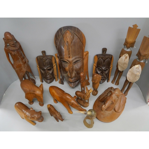 2119 - A collection of wood carvings, including African tourist pieces