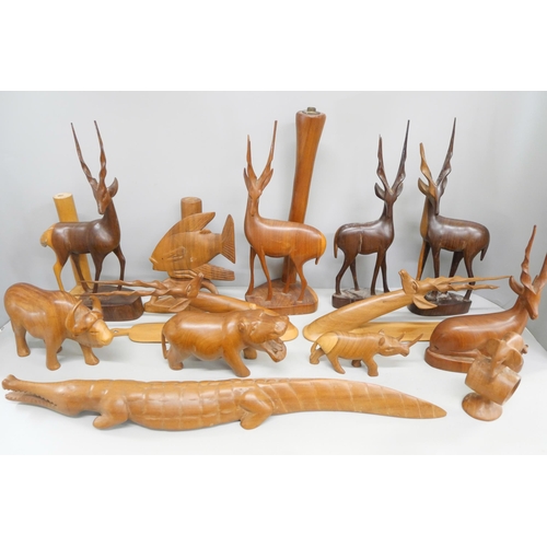 2119 - A collection of wood carvings, including African tourist pieces