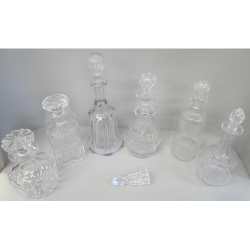 2122 - A collection of five glass decanters with stoppers, including 19th Century, one other decanter witho... 