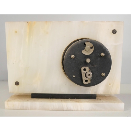 2212 - An Art Deco onyx/alabaster clock, lacking glass in front panel