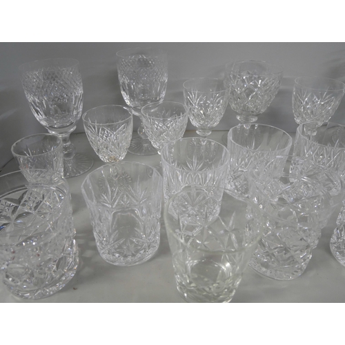 2228 - A collection of crystal glassware comprising sherry glasses, eight tumblers and wine glasses, variou... 