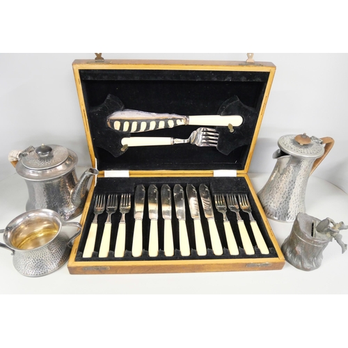 2241 - A collection of plated flatware including plated and cased and a hammered Britannia metal tea servic... 