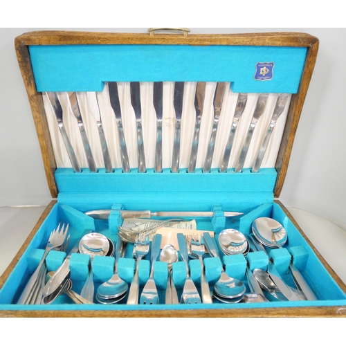 2241 - A collection of plated flatware including plated and cased and a hammered Britannia metal tea servic... 