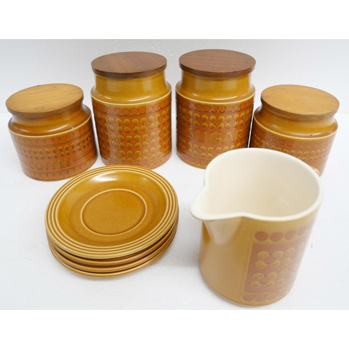 2266 - A collection of Hornsea pottery kitchenware comprising tea, coffee, sugar canisters, saucers and a j... 