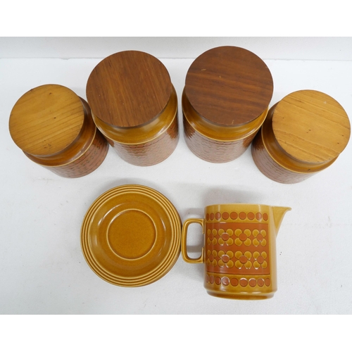 2266 - A collection of Hornsea pottery kitchenware comprising tea, coffee, sugar canisters, saucers and a j... 