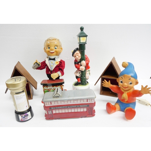 2271 - A collection of novelty items including a Japanese bartender figure, Noddy lamp, Scottish music figu... 