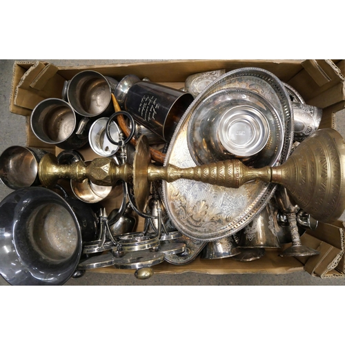 2277 - A box of silver plate; two sets of goblets, trays, mugs, etc., and a tall Indian brass candlestick *... 