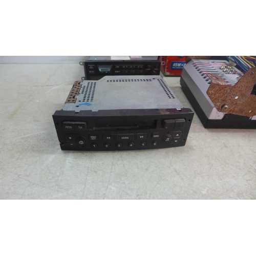 5148 - A large quantity of assorted car stereos including Pioneer, Ford, Jaguar, Siemens, Sony, etc.