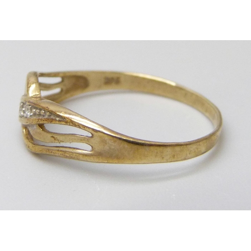 7009 - Two 9ct gold rings, one set with white spinel, 1.2g, Q, and a knot ring, 1g, F