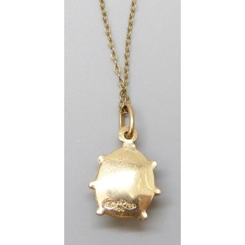 7015 - An 18ct gold & enamelled ladybird pendant, 1.5g, on a 9ct gold chain, 0.6g