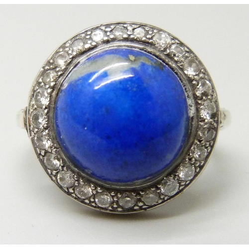 7025 - An Art Deco lapis lazuli and diamond ring, stamped 750, 5.6g, J