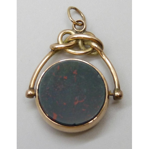 7029 - A Victorian 9ct gold mounted swivel fob set with carnelian and blood stone, Birmingham 1892, 6.2g, 3... 