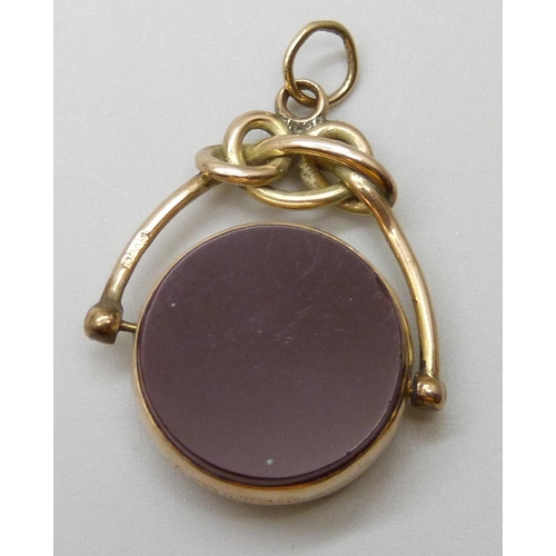 7029 - A Victorian 9ct gold mounted swivel fob set with carnelian and blood stone, Birmingham 1892, 6.2g, 3... 