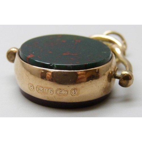 7029 - A Victorian 9ct gold mounted swivel fob set with carnelian and blood stone, Birmingham 1892, 6.2g, 3... 