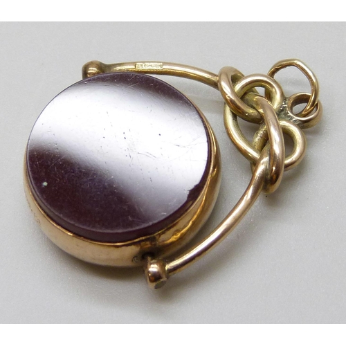 7029 - A Victorian 9ct gold mounted swivel fob set with carnelian and blood stone, Birmingham 1892, 6.2g, 3... 