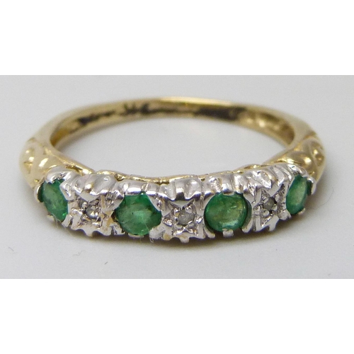 7030 - A yellow metal, emerald and diamond ring, stamped 9k, 1.8g, N