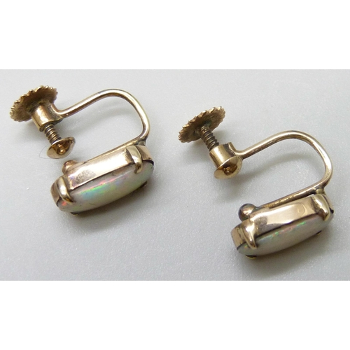 7033 - A pair of 9ct gold opal set earrings with screw backs, 2.1g