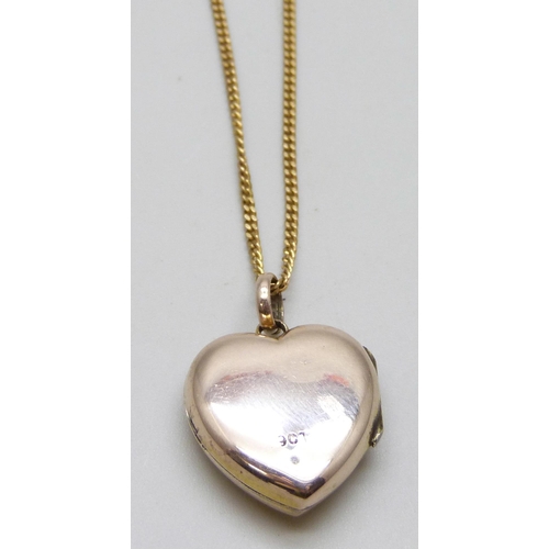 7040 - A 9ct gold locket set with diamond, on a 9ct gold curb chain, 6.9g, 2.3cm