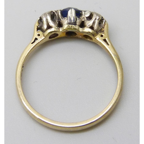 7043 - An 18ct gold, sapphire and diamond three stone ring, 2.6g, N