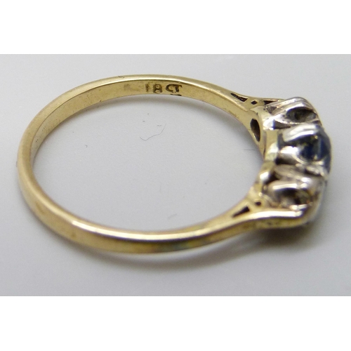 7043 - An 18ct gold, sapphire and diamond three stone ring, 2.6g, N