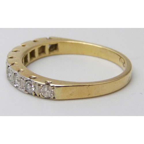 7044 - An 18ct gold, nine stone diamond half eternity ring, 2.6g, K