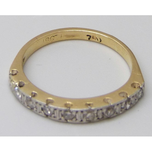 7044 - An 18ct gold, nine stone diamond half eternity ring, 2.6g, K