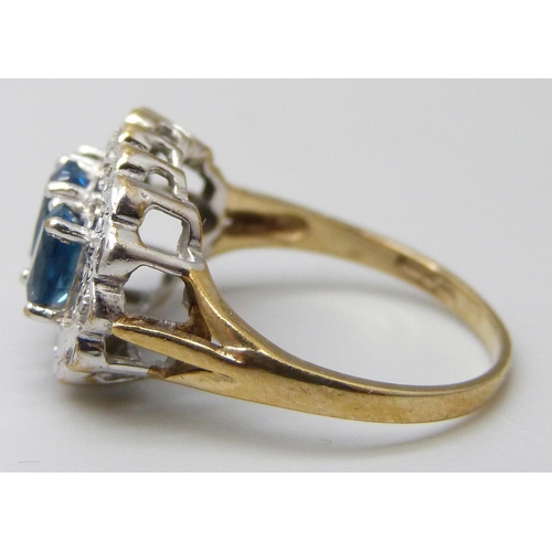 7045 - A 9ct gold, blue spinel and diamond accent ring, 3.1g, L