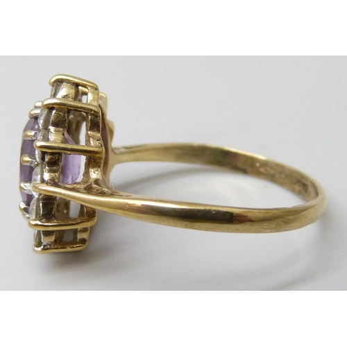 7046 - A 9ct gold, amethyst and cubic zirconia cluster ring, 2.4g, M