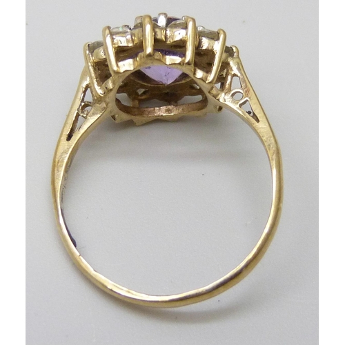 7046 - A 9ct gold, amethyst and cubic zirconia cluster ring, 2.4g, M