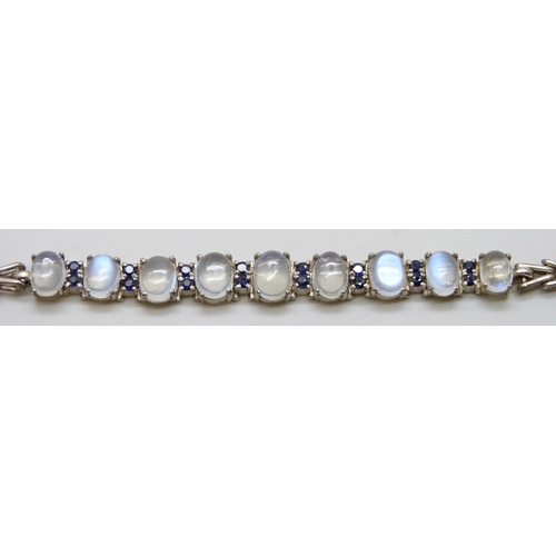 7048 - A silver bracelet set with moonstones and sapphires, 11g, 16cm