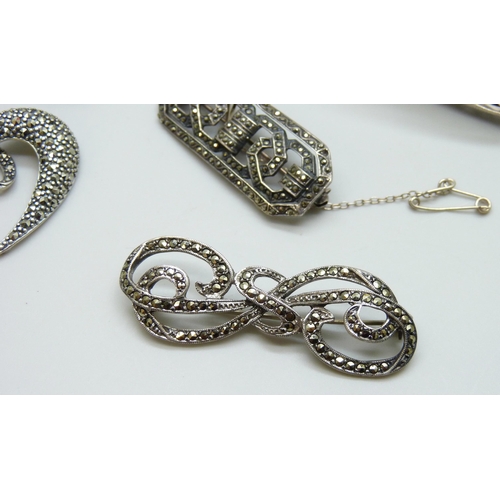 7058 - A collection of silver and marcasite jewellery - a bracelet, two brooches and a pendant, 41g, togeth... 