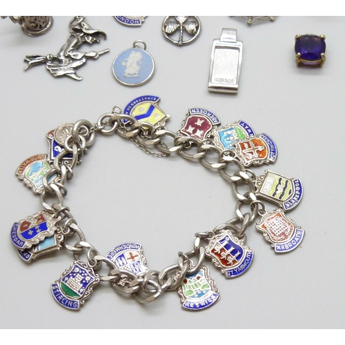 7060 - A collection of silver jewellery - a charm bracelet with enamelled charms, together with other silve... 