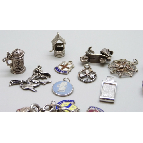 7060 - A collection of silver jewellery - a charm bracelet with enamelled charms, together with other silve... 