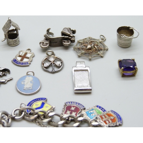 7060 - A collection of silver jewellery - a charm bracelet with enamelled charms, together with other silve... 