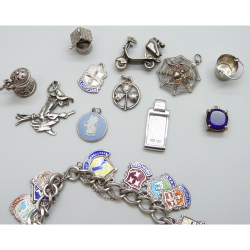 7060 - A collection of silver jewellery - a charm bracelet with enamelled charms, together with other silve... 