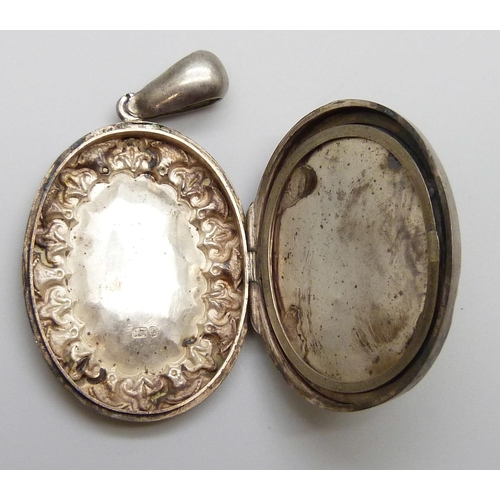 7066 - A Victorian silver locket, a silver and enamel pendant, a/f, a silver lamp charm, a silver horseshoe... 