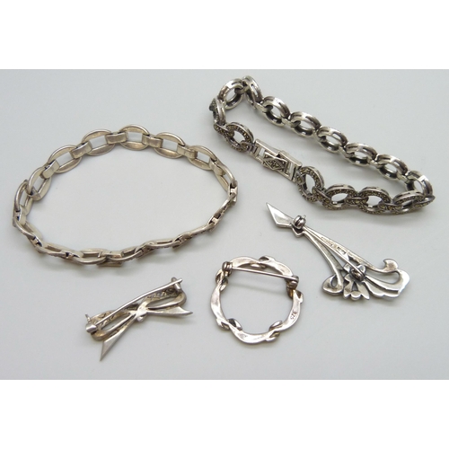 7067 - A collection of silver and marcasite jewellery - two bracelets and two brooches, 44g, and an unmarke... 