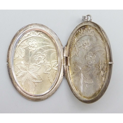 7068 - A Georg Jensen silver locket, 4cm, and a larger silver locket, 19g