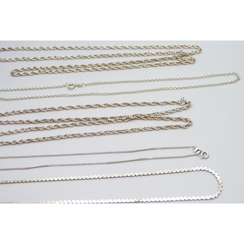 7069 - Five silver chains and a silver bracelet, 48g