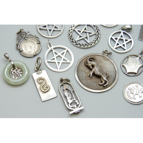 7070 - A collection of 12 silver pendants including a large UnoAerre Zodiac ram pendant, 4.5cm, and a Charl... 