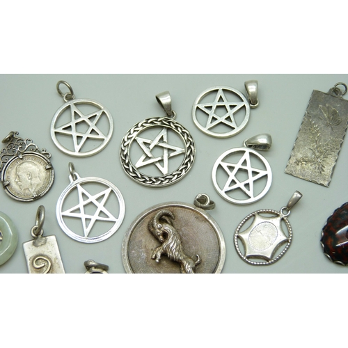 7070 - A collection of 12 silver pendants including a large UnoAerre Zodiac ram pendant, 4.5cm, and a Charl... 