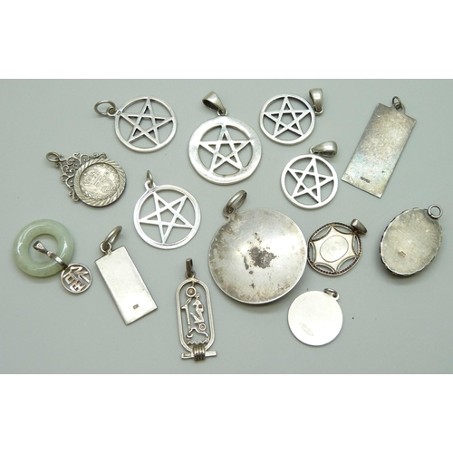 7070 - A collection of 12 silver pendants including a large UnoAerre Zodiac ram pendant, 4.5cm, and a Charl... 