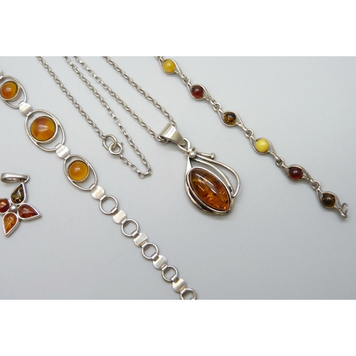 7080 - A collection of silver and amber jewellery - three pendants and a bracelet, together with another si... 