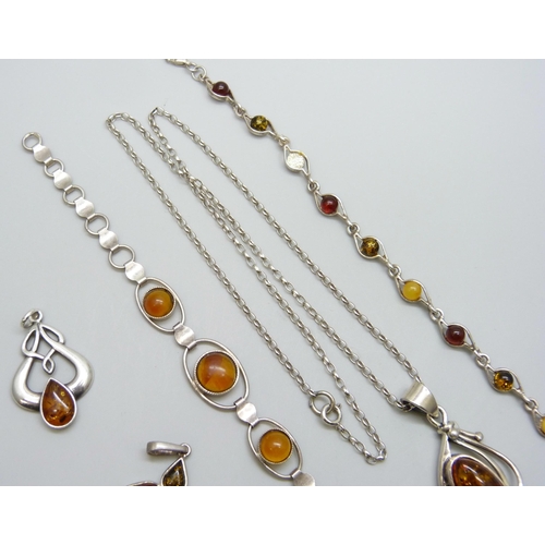 7080 - A collection of silver and amber jewellery - three pendants and a bracelet, together with another si... 