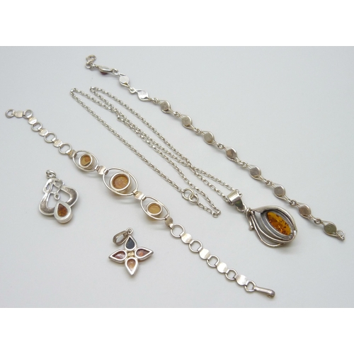 7080 - A collection of silver and amber jewellery - three pendants and a bracelet, together with another si... 