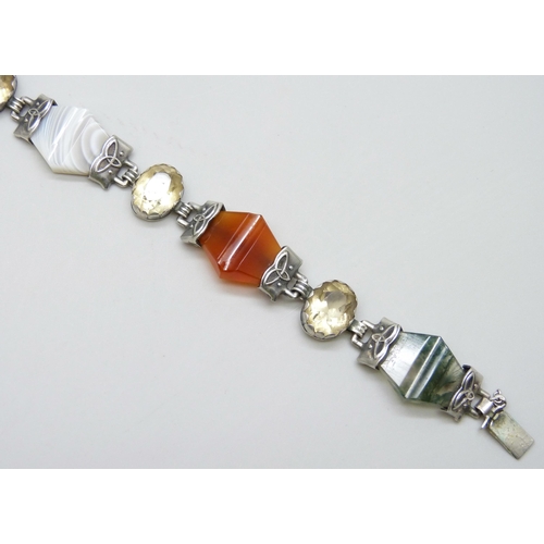 7086 - A white metal Scottish stone set panel bracelet including amethyst and moss agate, safety chain a/f,... 