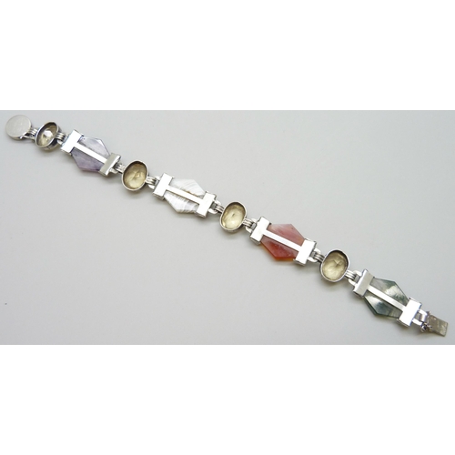 7086 - A white metal Scottish stone set panel bracelet including amethyst and moss agate, safety chain a/f,... 