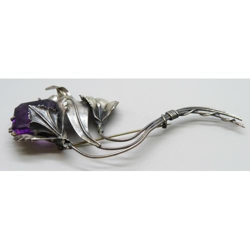 7093 - A large silver flower brooch marked sterling, set with a purple glass stone, 31g, 12.3g